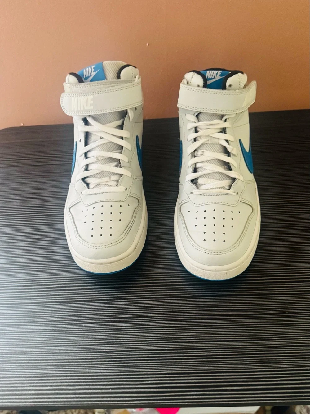 Nike White High-Top Sneakers with Blue Swoosh Accents